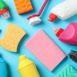 Sponges and products of all colours on a blue background