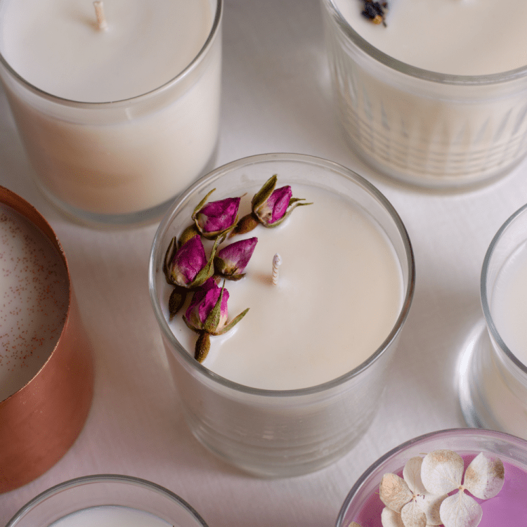Candles with dried flowers on top.