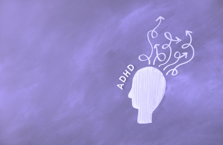 A paper cut-out of a head with windy arrows flying out of it. The arrows represents thoughts. Next to the head reads "ADHD".