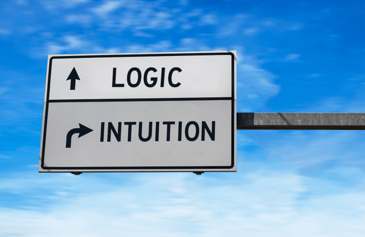 A road sign that reads "logic" with an ahead arrow and "INTUITION" with a turn right arrow.