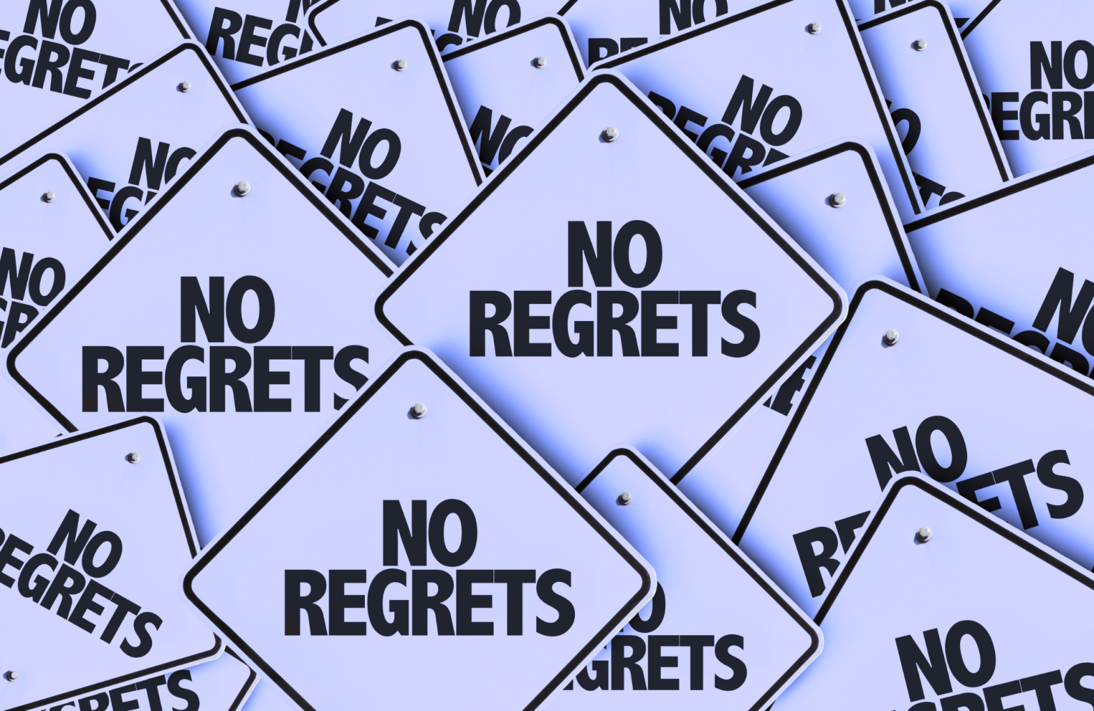 A bunch of diamond shaped signs that read "NO REGRETS".