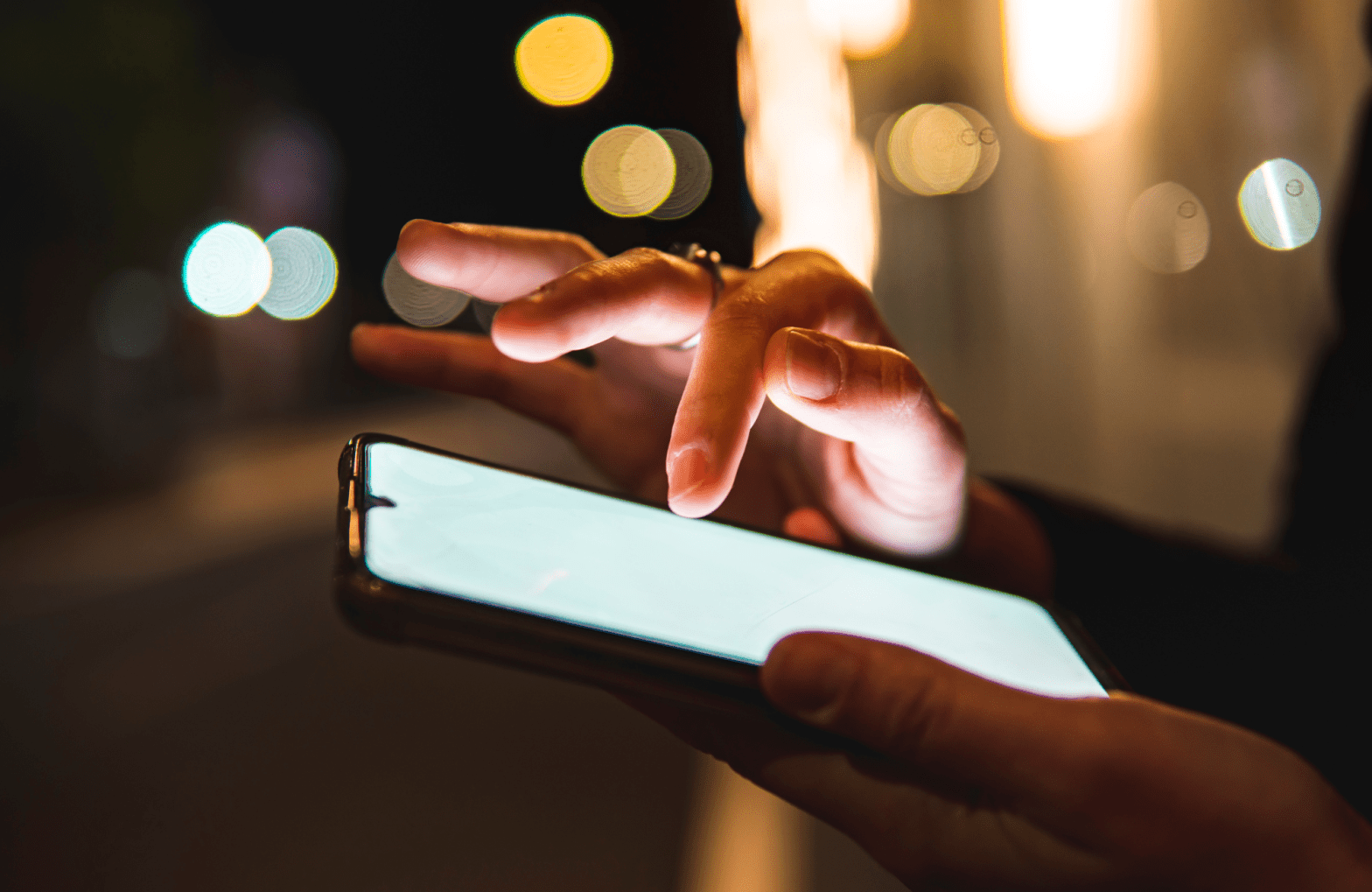 Hand scrolling on a phone.